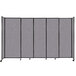 A Versare Cloud Gray StraightWall sliding room divider with black trim on wheels.