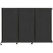 A black wall-mounted Versare Quick-Wall folding room divider with black metal frames.