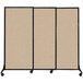 A beige Versare Quick-Wall sliding room divider with black frame on wheels.