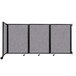 A Versare wall-mounted room divider with a Cloud Gray fabric and black frame.