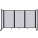 A Versare marble gray SoundSorb folding room divider with black frame on wheels.