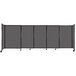 A Versare charcoal gray StraightWall sliding room divider with four panels.