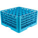 A blue plastic Carlisle glass rack with many compartments and extenders.