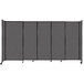 A Versare charcoal gray StraightWall sliding room divider with wheels.