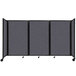 A dark gray Versare SoundSorb folding room divider with four panels.