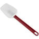 A white and red silicone spoonula with a handle.