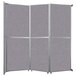A Versare room divider with grey fabric panels.