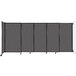A Versare charcoal gray wall-mounted room divider with four sliding doors.