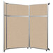 A Versare beige fabric room divider with metal frame.