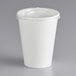 A white paper cup with a flat lid on top.