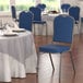 Lancaster Table & Seating Navy Fabric Crown Back Stackable Banquet Chair with Silver Vein Frame Main Thumbnail 1