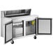 An Avantco stainless steel refrigerated sandwich/salad prep table with two doors open.