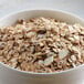 A bowl of Bob's Red Mill Old Country Style Muesli with almonds and raisins.