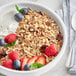 A bowl of Bob's Red Mill Muesli with fruit and yogurt.