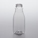 A clear plastic round juice bottle with a lid.