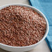 A bowl of Bob's Red Mill brown flax seeds.