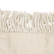 A close-up of a white fringed fabric.