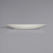 A white Fortessa Caldera china plate with a small rim on a gray surface.