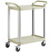 A beige plastic utility cart with two shelves, wheels, and a handle.