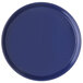 A blue round Carlisle melamine serving tray with a rim.