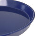 A Carlisle cobalt blue melamine serving tray with a rim.
