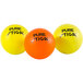 A group of orange and yellow Stiga ping pong balls with black text.