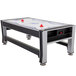 A Triumph 3-in-1 Swivel Game Table with air hockey set up.