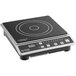 A black and silver Global Solutions portable countertop induction range.