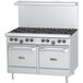 A white U.S. Range commercial gas range with black knobs.