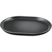 A black oval raised rim melamine platter on a table.