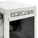 A white box with a black label and a Paragon popcorn machine with black text that says "Mod Pop" on it.