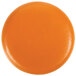 A dark yellow Gouda cheese replica on an orange round surface.