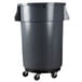 A black Rubbermaid trash can dolly attached to a grey trash can on wheels.