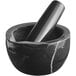 A black marble mortar and pestle set.