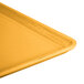 A close-up of a yellow Cambro dietary tray.