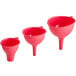 A set of three red Fox Run silicone canning funnels.