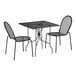 A Lancaster Table & Seating Harbor Black outdoor table with ornate legs and 2 chairs.