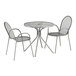A Lancaster Table & Seating Harbor Gray outdoor table with modern legs and two arm chairs on a white background.