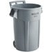 A Rubbermaid BRUTE 44 gallon gray trash can with wheels.
