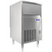 A large silver rectangular Manitowoc undercounter ice machine with a stainless steel drawer.
