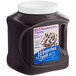 A plastic container of J. Hungerford Smith Black Raspberry dessert topping.