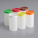A group of six Choice plastic containers with assorted color caps.