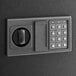 A black steel wall mount 133-key cabinet safe with electronic keypad lock.
