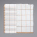 A stack of tan and white windowpane patterned towels.