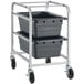 A metal cart with two gray plastic bins on it.