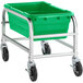 A green plastic Regency meat lug cart on black wheels.