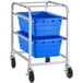 A metal Regency lug rack with two blue plastic bins on it.