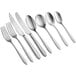 A group of Acopa Pangea stainless steel dinner knives and spoons.