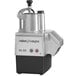 A Robot Coupe CL50 food processor with a white cover over a silver and black base.