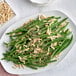 A plate of green beans with Blanched Slivered Almonds.